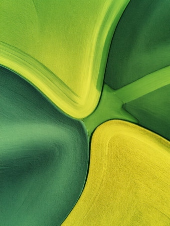 Colorful green and yellow patterns intertwine in an abstract design, displaying smooth transitions and textures that evoke a sense of movement.の素材