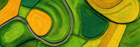 Aerial view of vibrant green and yellow fields under blue skies, showcasing farming techniques and beautiful landscapes.の素材