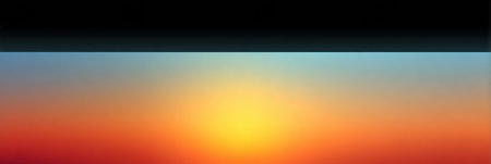 A serene sunset displays vibrant colors across the horizon, blending oranges, yellows, and blues in a peaceful evening sky.の素材