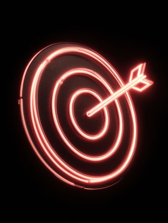 Neon target design features an arrow striking the center, illuminated in vibrant red, highlighting precision and focus in the dim environment.の素材