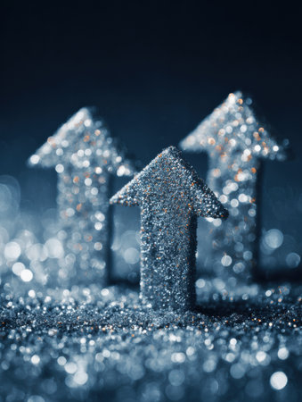 Three glittering arrows are arranged in an upward direction, surrounded by a soft blur of sparkling particles in a dark environment.の素材