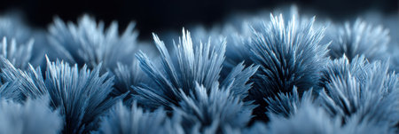Beautiful blue crystal structures emerge from a dark background, showcasing sharp, pointed shapes that create a mesmerizing natural spectacle.の素材