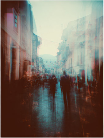 A bustling urban street at dusk filled with people, shops, and colorful lights creating a vibrant yet hazy scene of daily life in the city.の素材