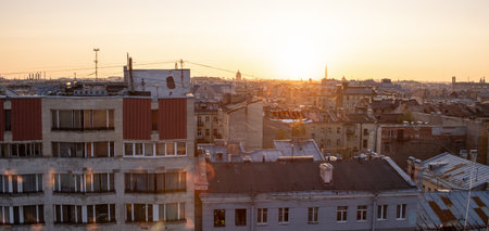 Golden sunlight cascades over St Petersburgs historic rooftops, highlighting the unique architectural details during a tranquil sunset.の写真素材