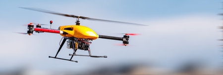 A bright yellow drone hovers in the sky, demonstrating its capabilities as it captures stunning views of the landscape.の素材