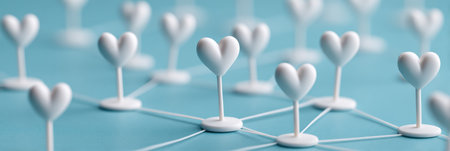 White hearts on strings, blue background. Network of connections.の素材