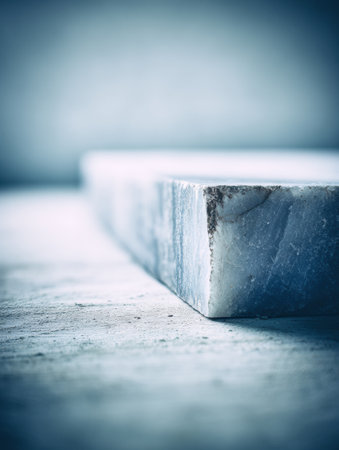 Close-up of a marble block highlighting its texture and color in soft light for an elegant look.の素材