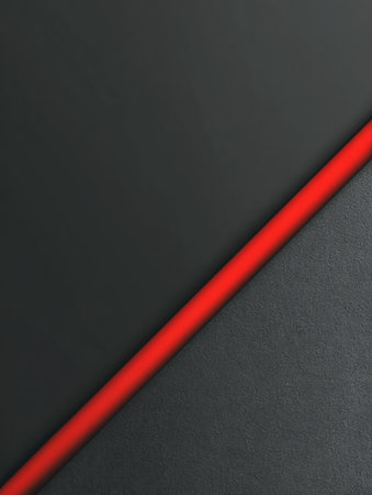 A bright red diagonal line divides two gray textured surfaces, creating a simple yet modern background.の素材