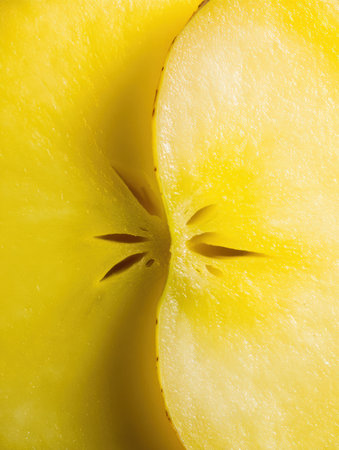A halved Star Fruit is displayed, detailing its unique texture and seed formations, highlighting its natural beauty.の素材