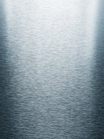 A smooth metallic surface reflects soft light, creating gentle gradients and textures that enhance its visual appeal.の素材
