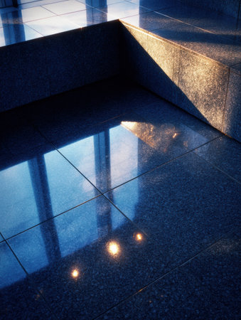 Light reflects on glossy surfaces, creating color and texture in contemporary architecture during the day.の素材