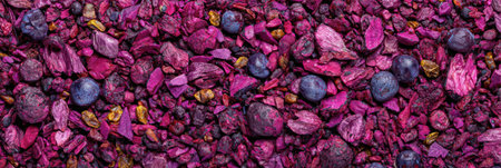 Vibrant mixture of crushed stone and minerals in rich purple tones, showing hues of blue and yellow in a unique, textured arrangement.の素材