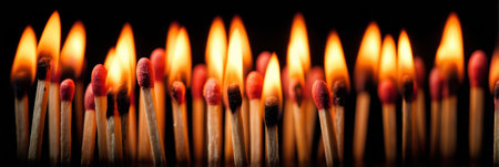 A lit match stands out in a dark space, representing how a single idea can ignite solutions to significant challenges.の素材