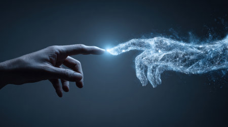 A human hand reaches out to connect with an AI hand, creating a bright spark that symbolizes progress through technology and cooperation.の素材