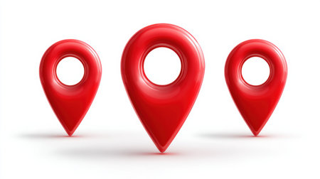 Set of red pointer icons showing map locations arranged in a group on a plain white surface for graphic design or navigation use.の素材