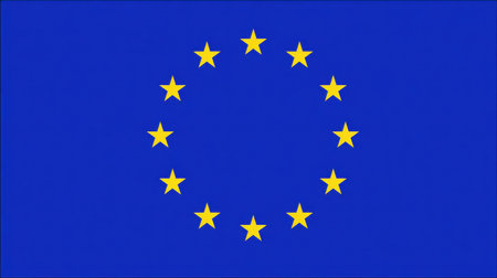 The European Union flag displays twelve gold stars arranged in a circle on a blue background, symbolizing unity among nations in Europe.の素材