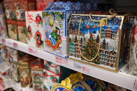 Colorful Holiday Gift Boxes Displayed on Shelves in a Festive Shopping Store During the Winter Seasonのeditorial素材