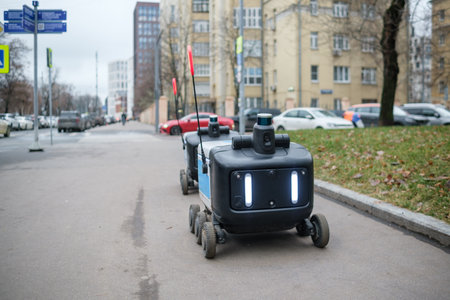 Robots Delivering Food on a City Street During a Cloudy Day