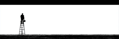 A mature man stands on a ladder painting a wall. He holds a paintbrush as he works on a large white surface.の素材