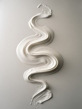 Metallic silver merges with white in a flowing pattern. This design showcases smooth curves and a blend of soft colors on a plain surface.の素材