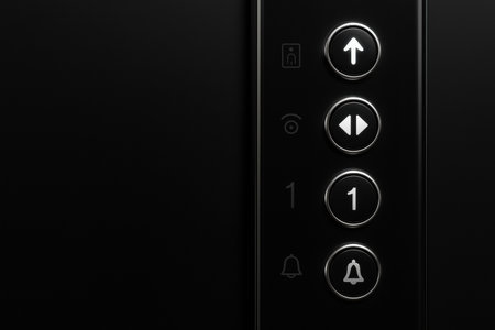 Elevator Control Panel Exhibiting Buttons for Floor Selection, Door Operation, and Emergency Features in a Modern Settingの素材