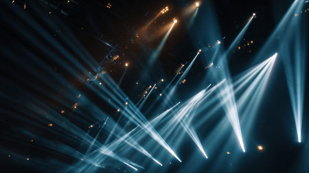 Stage lights beam sharp rays across the space, adding energy to the concert atmosphere while leaving room for creative visuals.の素材