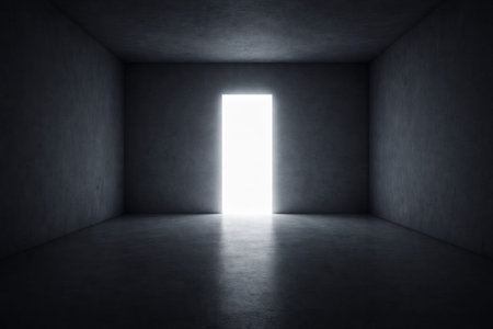 A dark room with smooth walls and a bright door open to light. The stark contrast shows the rooms emptiness and hints at what lies beyond.の素材