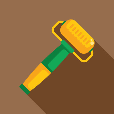 Yellow and green paint roller lying on a brown background with a shadowのイラスト素材