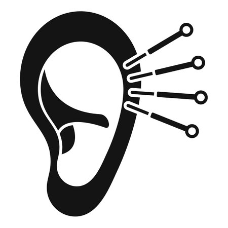 Black and white icon of ear acupuncture, stimulating specific points with needles for therapeutic benefitsのイラスト素材