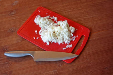 finely chopped onion on a cutting boardの写真素材