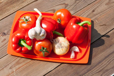 Different, fresh, healthy vegetables laid out on the dark surface of the tableの写真素材