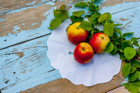 Red apples on the old wooden table. Top view.の写真素材