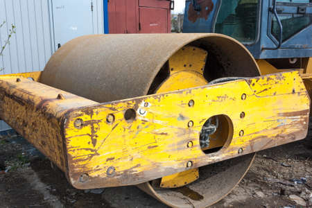 Old asphalt machine roller close-up after workの写真素材