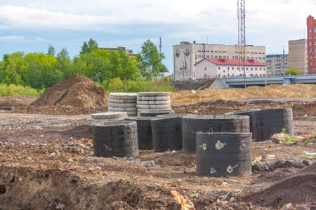 Concrete shaft manhole rings on a building siteの写真素材
