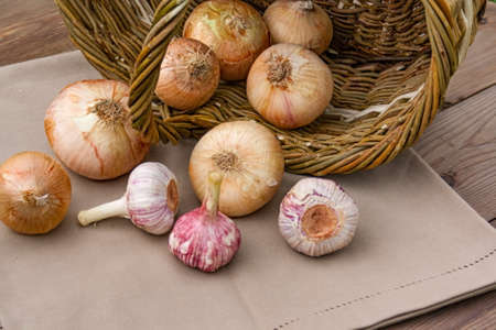 Fresh vegetables in a basket on a nature backgroundの写真素材