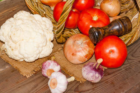 Fresh vegetables in a basket on a nature backgroundの写真素材