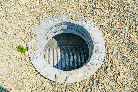 Concrete construction tube pipe. Building a road sewer drain system