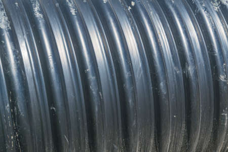 Pipes of PVC large diameter prepared for laying on construction siteの写真素材