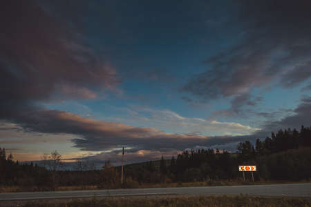 Sunset at the edge of the forest in the Ural Mountains in autumnの写真素材