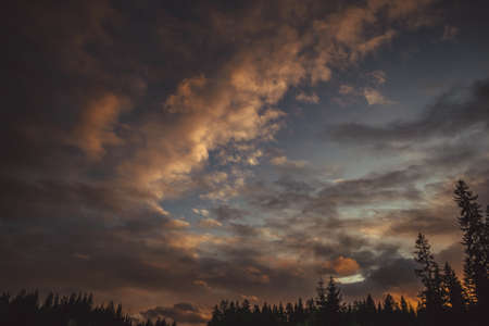 Sunset at the edge of the forest in the Ural Mountains in autumnの写真素材