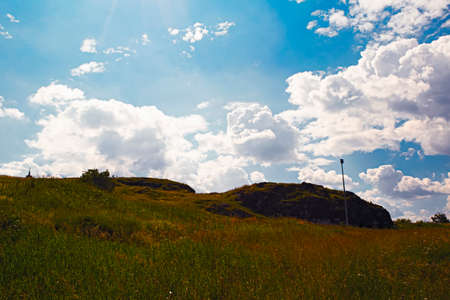 Summer landscape on the mountain against the sky and cloudsの写真素材