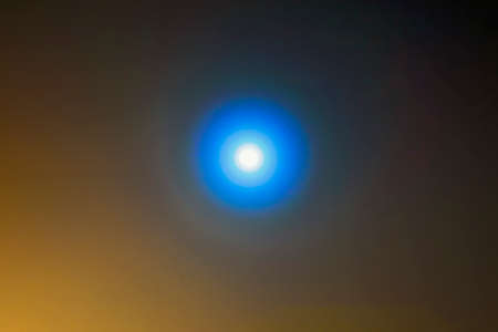 Moon in the winter night sky blurred backgroundの写真素材