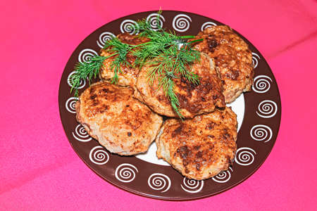 Homemade chicken cutlets and fresh greens. Plate full of delicious chicken cutlets prepared for eat....