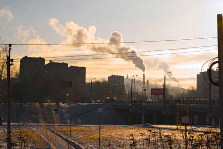 Sunset in the industrial city during winterの写真素材