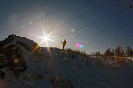Female silhouette at the top of the mountainの写真素材