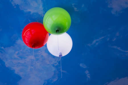 Fragment of the ceiling with colorful balloons in a children's cafeの写真素材