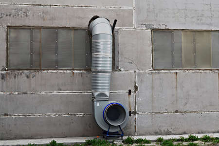 Ventilation system on the wall of a production buildingの写真素材