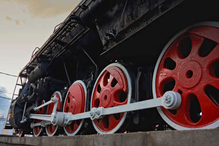 Old Soviet steam locomotive against the skyの写真素材