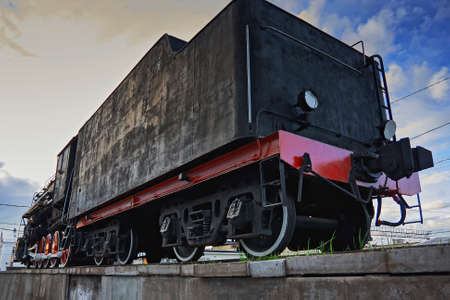 Old Soviet steam locomotive against the skyの写真素材