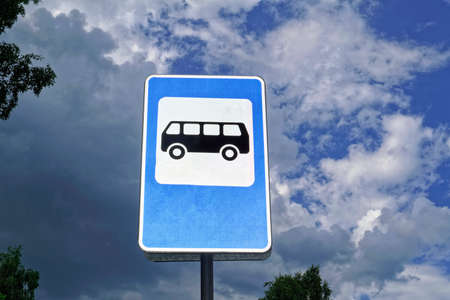 Bus stop road sign on background of blue sky. Information sign.の写真素材